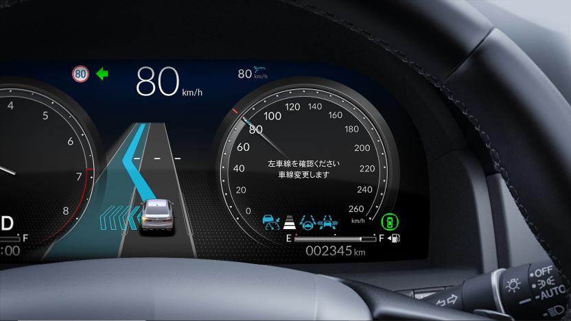 a picture of a driver's dashboard showing an automated lane change animation