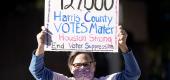 A demonstrator holds up a sign. (AP)