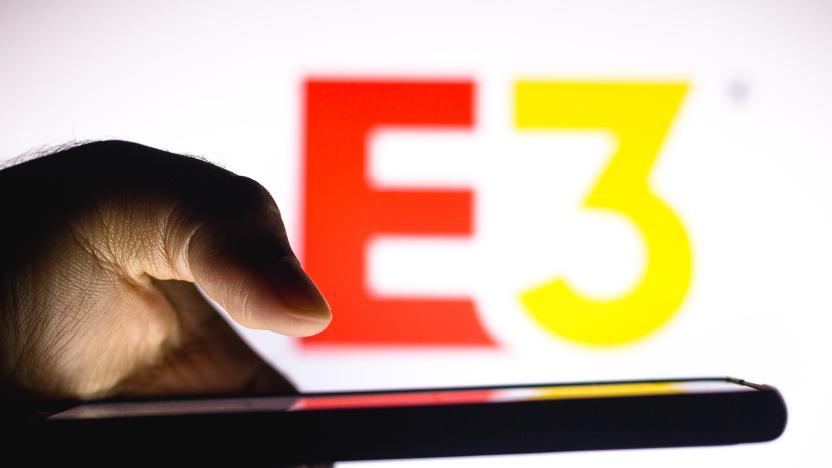 BRAZIL - 2021/01/20: In this photo illustration, a hand of a person holds a smartphone with an Electronic Entertainment Expo (E3) logo displayed in the background. (Photo Illustration by Rafael Henrique/SOPA Images/LightRocket via Getty Images)