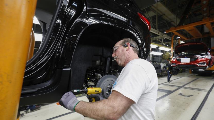 LANSING, MI - FEBRUARY 21: A General Motors worker is shown on the assembly line at the General Motors Lansing Delta Township Assembly Plant on February 21, 2020 in Lansing, Michigan. The plant, which employs over 2,500 workers, is home to the Chevrolet Traverse and Buick Enclave. Today at the plant the three millionth vehicle made at the plant, a Chevrolet Traverse Redline Edition rolled off the line. (Photo by Bill Pugliano/Getty Images)