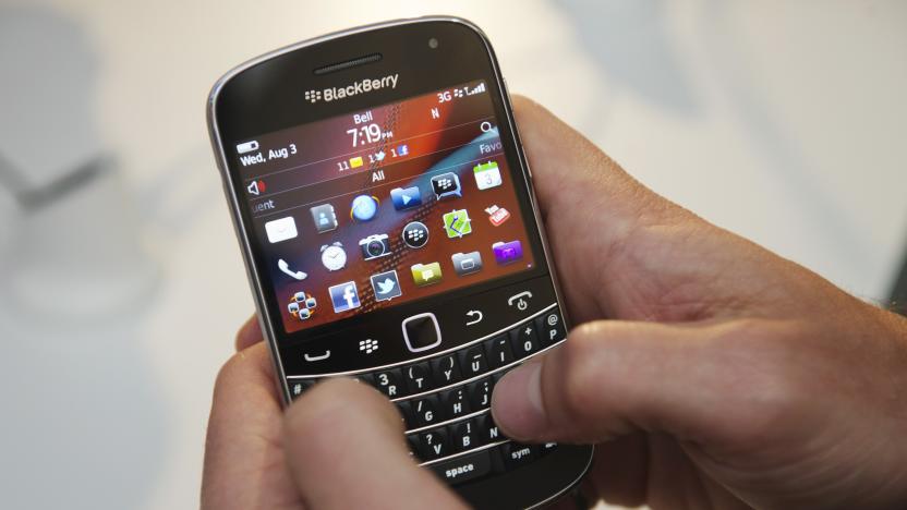 A person uses the new Blackberry Bold 9900 at a release party to promote the BlackBerry OS 7 devices in Toronto August 3, 2011. Research In Motion (RIM) on Wednesday took the wraps off two more powerful versions of its touchscreen BlackBerry Torch, aiming to buy time until it can introduce a radically new software package in its smartphones.   REUTERS/Mark Blinch (CANADA - Tags: SCI TECH BUSINESS)