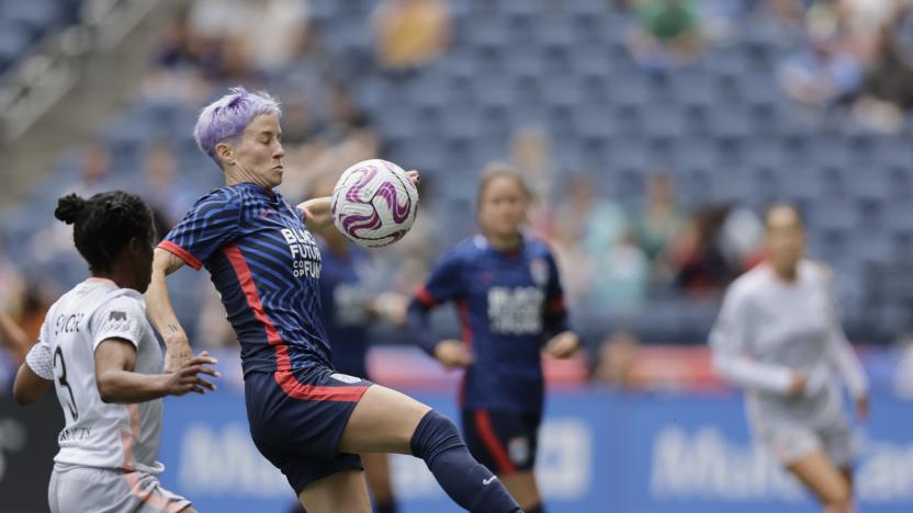 May 27, 2023; Seattle, Washington, USA; OL Reign forward Megan Rapinoe (15) plays the ball pressured by Angel City FC forward Jasmyne Spencer (3) in the first half at Lumen Field. Mandatory Credit: John Froschauer-USA TODAY Sports