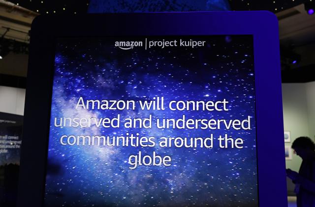 LAS VEGAS, NEVADA - JANUARY 07: Amazon’s description of Project Kuiper, an initiative to build a low Earth orbit (LEO) satellite constellation capable of providing reliable, affordable broadband service to unserved and underserved communities around the world, is displayed on a screen at CES 2023 at Venetian Expo on January 07, 2023 in Las Vegas, Nevada. CES, the world's largest annual consumer technology trade show, runs through January 08 and features about 3,200 exhibitors showing off their latest products and services to more than 100,000 attendees. (Photo by Alex Wong/Getty Images)