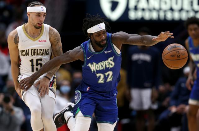 Jan 11, 2022; New Orleans, Louisiana, USA; Minnesota Timberwolves guard Patrick Beverley (22) loses the ball after colliding with New Orleans Pelicans guard Jose Alvarado (15) in the second half  at the Smoothie King Center. Mandatory Credit: Chuck Cook-USA TODAY Sports