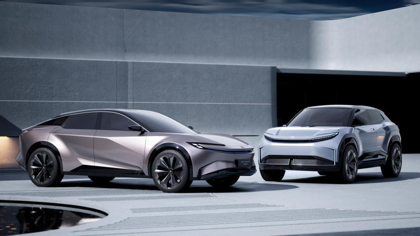 Two electric SUV concepts from Toyota sit in a modern showroom. A crossover with fastback (sloping) profile sits on the left, and an “Urban SUV” is on the right.