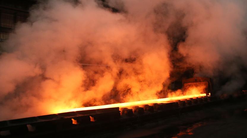 Steam rolls off a slab of steel as it rolls down the line at the Novolipetsk Steel PAO steel mill in Farrell, Pennsylvania, U.S., March 9, 2018. REUTERS/Aaron Josefczyk