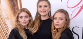 Elizabeth Olsen with sisters Mary-Kate and Ashley Olsen. (Getty Images)