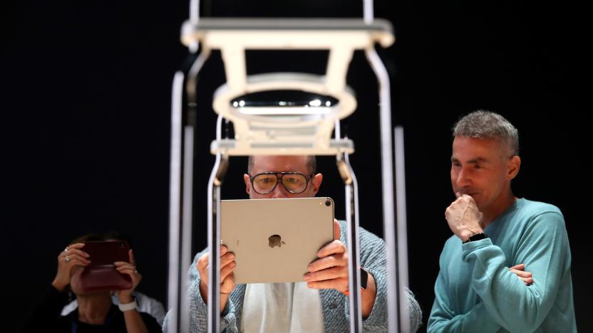 SAN JOSE, CALIFORNIA - JUNE 03: Apple chief design officer Jony Ive (L) uses an iPad to have an augmented reality view of the frame of the new Mac Pro as Apple senior VP of hardware engineering Dan Riccio (R) looks on during the 2019 Apple Worldwide Developer Conference (WWDC) at the San Jose Convention Center on June 03, 2019 in San Jose, California. The WWDC runs through June 7. (Photo by Justin Sullivan/Getty Images)