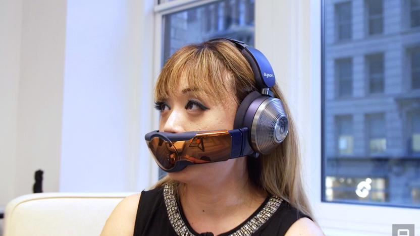 A woman wearing the Dyson Zone headphone and air filter combo unit.