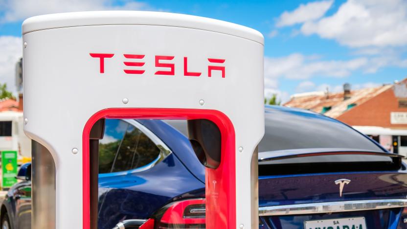 Adelaide CBD, Australia - November 18, 2017: Tesla Supercharger EV charging station with Tesla Model X car in city centre on Franklin Street on a day