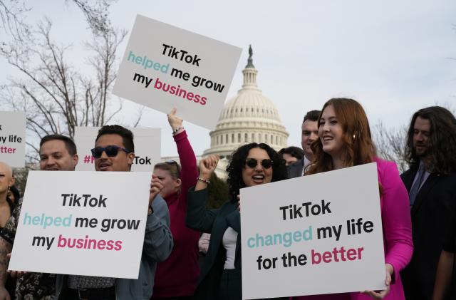 Devotees of TikTok gather at the Capitol in Washington, as the House passed a bill that would lead to a nationwide ban of the popular video app if its China-based owner doesn't sell, Wednesday, March 13, 2024. Lawmakers contend the app's owner, ByteDance, is beholden to the Chinese government, which could demand access to the data of TikTok's consumers in the U.S. (AP Photo/J. Scott Applewhite)