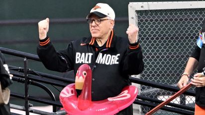 Getty Images - BALTIMORE, MARYLAND - MAY 10: Majority owner David Rubenstein of the Baltimore Orioles celebrates with Mr. Splash during the second inning against the Arizona Diamondbacks at Oriole Park at Camden Yards on May 10, 2024 in Baltimore, Maryland.  (Photo by G Fiume/Getty Images)