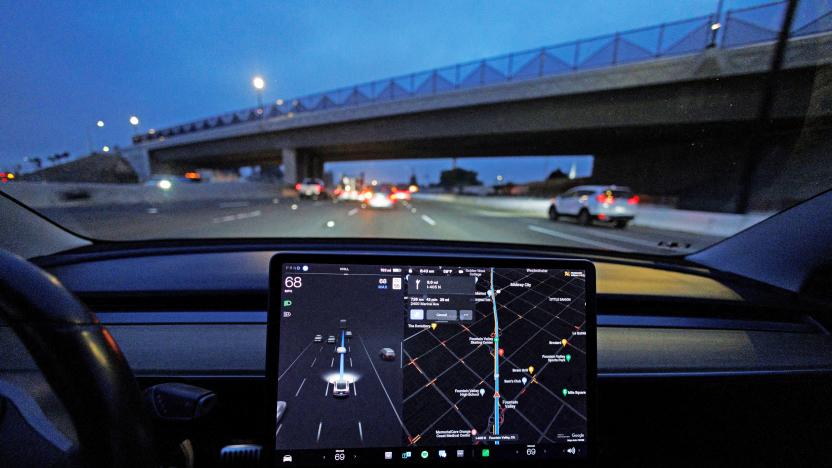 A Tesla Model 3 vehicle drives on autopilot along the 405 highway in Westminster, California, U.S., March 16, 2022. 