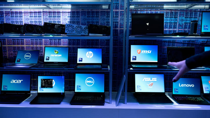 Laptop computers using Intel chips are shown at an Intel exhibit before this week's Consumer Electronics Show (CES), January 8, 2024, in Las Vegas, Nevada. (Photo by Brendan Smialowski / AFP) (Photo by BRENDAN SMIALOWSKI/AFP via Getty Images)