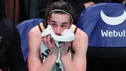 Getty Images - BROOKLYN, NY - JUNE 02: Caitlin Clark #22 of the Indiana Fever puts a towel up to her face on the bench during the first quarter of the Commissioners Cup WNBA game against the New York Liberty on June 2, 2024 at the Barclayys Center in Brooklyn, New York.  (Photo by Rich Graessle/Icon Sportswire via Getty Images)