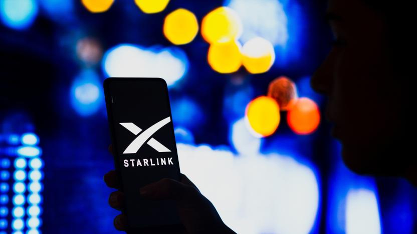 BRAZIL - 2022/05/02: In this photo illustration, a silhouetted woman holds a smartphone with the Starlink logo displayed on the screen. (Photo Illustration by Rafael Henrique/SOPA Images/LightRocket via Getty Images)