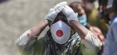 A relative of a person who died of COVID-19 reacts at a crematorium in Jammu, India. (AP)