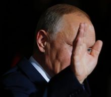 Putin in firing line over Ukraine, Syria at Berlin talks