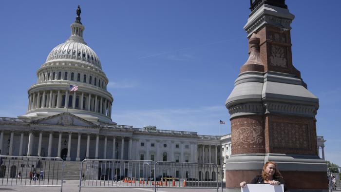 Jennifer Gay, a TikTok content creator, sits outside the U.S. Capitol, Tuesday, April 23, 2024, in Washington as Senators prepare to consider legislation that would force TikTok’s China-based parent company to sell the social media platform under the threat of a ban, a contentious move by U.S. lawmakers. (AP Photo/Mariam Zuhaib)