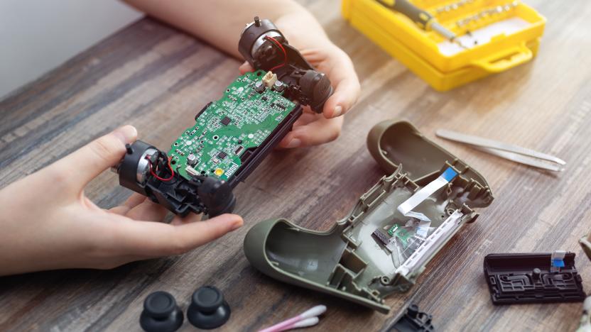 Close up of disassemble game controller repairing, cleaning or diagnostic.