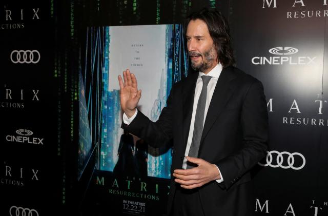 Actor Keanu Reeves poses during the "Black Carpet" of the Canadian premiere of The Matrix Resurrections film in his former home town of Toronto, Ontario, Canada, December 16, 2021.  REUTERS/Carlos Osorio