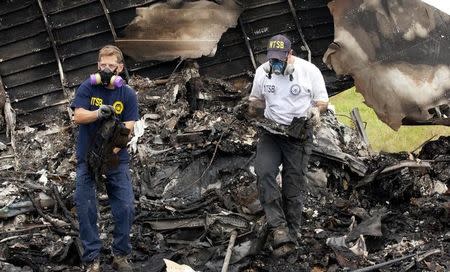 ntsb ups reuters handout flight recorders birmingham 1354 wreckage investigators transportation national withdrawn advisory story retrieve alabama voice safety taken