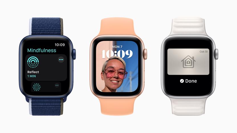 Three Apple Watches each showing a new feature from watchOS 8. From left to right: The new Mindfulness app, a new Portrait watch face and a home key.