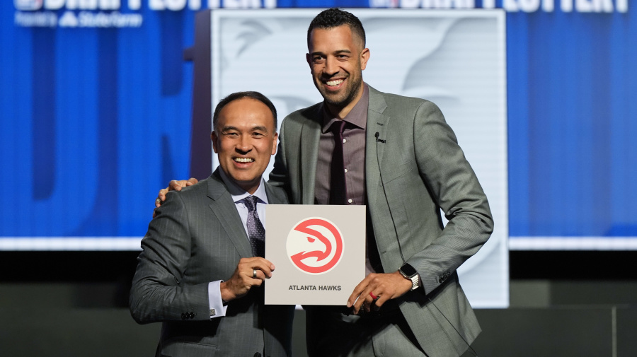 Associated Press - Atlanta Hawks general manager Landry Fields, right, and NBA Deputy Commissioner Mark Tatum pose for photos after Tatum announced that the Hawks had won the first pick in the NBA draft, during the draft lottery in Chicago, Sunday, May 12, 2024. (AP Photo/Nam Y. Huh)