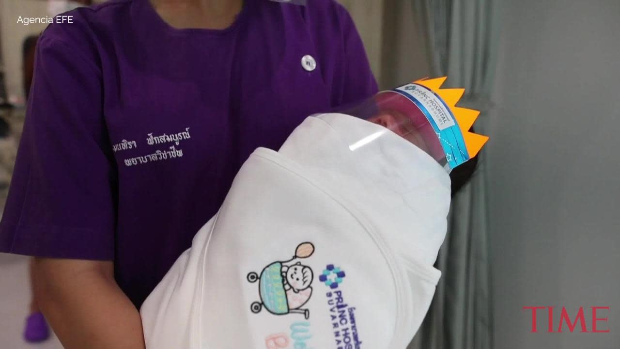 Newborn baby wears a face shield in Bangkok hospital