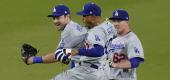 Los Angeles Dodgers center fielder Mookie Betts, center, celebrates with right fielder Luke Raley, right, and left fielder AJ Pollock after the Dodgers defeated the San Diego Padres 2-0. (AP)