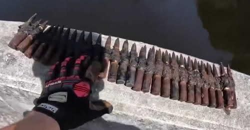 magnet fishers pull bag full of military equipment, 86 rockets out  of Georgia river