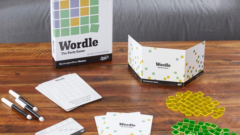 The physical Wordle home game and all its pieces are displayed on a living room coffee table.