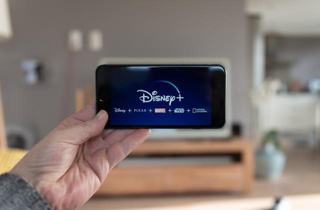 Amsterdam, The Netherlands, 02/03/2020, Disney+ startscreen on  mobile phone. Disney+ online video, content streaming subscription service. Disney plus, Star wars, Marvel, Pixar, National Geographic.