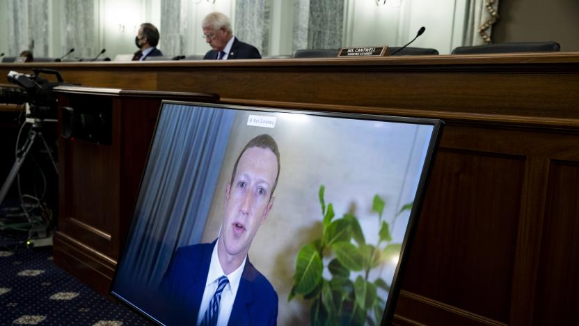 Facebook CEO Mark Zuckerberg appears on a screen as he speaks remotely during a hearing before the Senate Commerce Committee on Capitol Hill, Wednesday, Oct. 28, 2020, in Washington. The committee summoned the CEOs of Twitter, Facebook and Google to testify. (Michael Reynolds/Pool via AP)