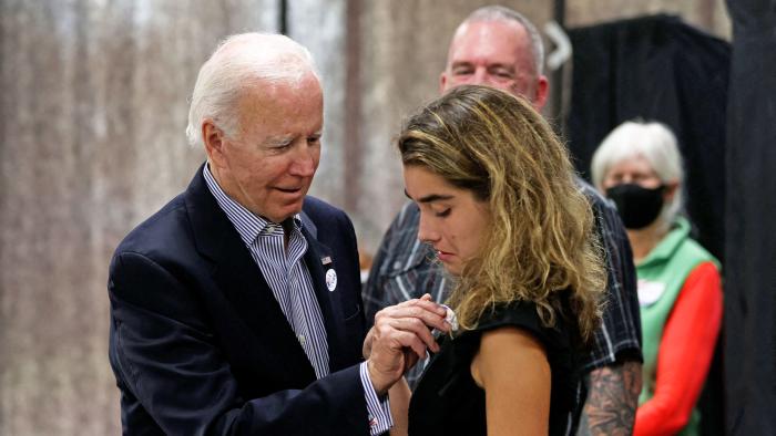 US President Joe Biden placed an 'voted' sticker on granddaughter Natalie Biden after they voted early, in Wilmington, Delaware on October 29, 2022. - Natalie Biden is a first-time voter and daughter of the late Beau Biden. 