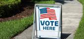 "Vote here" sign. (Getty Images)