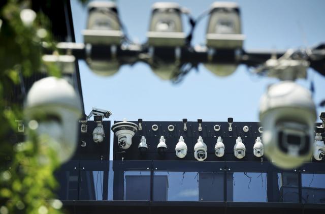 This picture shows Dahua surveillance cameras being installed on the Dahua Technologies office building in Hangzhou, in east China's Zhejiang province on May 29, 2019. (Photo by STR / AFP) / China OUT (Photo by STR/AFP via Getty Images)