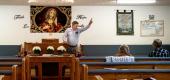 Rev. Guy Richardson leads a Sunday service at the Old Fashion Gospel House in Bulls Gap, Tenn. (New York Times)