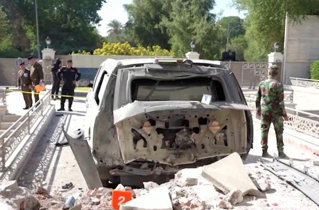 A destroyed vehicle is parked in front of Iraqi Prime Minister Mustafa al-Kadhimi's residence following an assassination attempt by an armed drone in Baghdad, Iraq in this screen grab taken from a handout video obtained by Reuters on November 7, 2021. PRIME MINISTER MEDIA OFFICE/Handout via REUTERS THIS IMAGE HAS BEEN SUPPLIED BY A THIRD PARTY. MANDATORY CREDIT