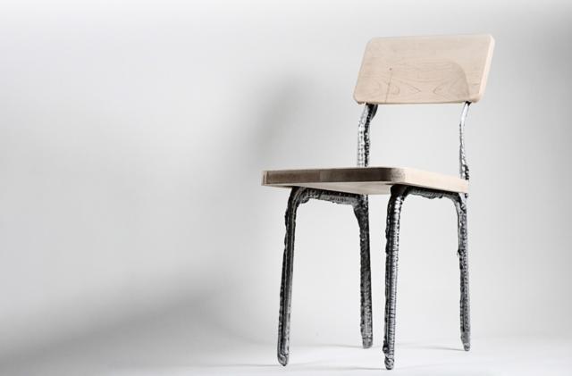 A wood chair with 3D-printed chair legs. 