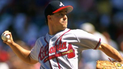 Getty Images - CHICAGO - 1993:  Greg Maddux of the Atlanta Braves pitches during an MLB game against the Chicago Cubs at Wrigley Field in Chicago, Illinois during the 1993 season. (Photo by Ron Vesely/MLB Photos via Getty Images) 