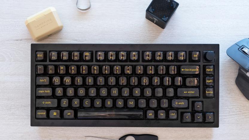 An overhead view of the new Q1 Pro mechanical keyboard from Keychron on a desk along with some accessories.