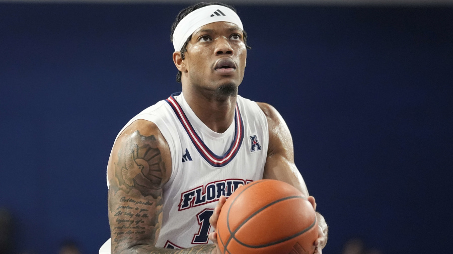 Associated Press - FILE - Florida Atlantic guard Alijah Martin (15) aims from the free throw line during the first half of an NCAA college basketball game against Wichita State, Thursday, Jan. 18, 2024, in Boca Raton, Fla. Florida Atlantic standout Martin, who helped propel the Owls to the Final Four in 2023, is moving about 300 miles north to play at Florida. The 6-foot-2 guard formally signed with the Gators on Monday, April 22, and is expected to become an immediate starter for coach Todd Golden in Gainesville. (AP Photo/Marta Lavandier, File)