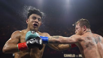 Associated Press - Canelo Alvarez hits Jaime Munguia in a super middleweight title fight Saturday, May 4, 2024, in Las Vegas. (AP Photo/John Locher)