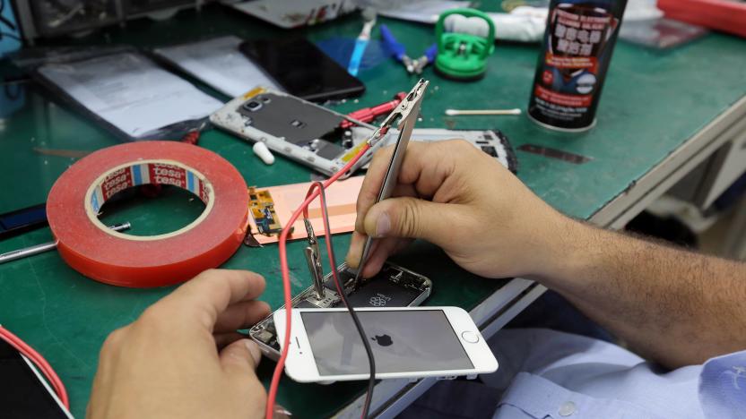 A technician repairs an iPhone at the Class cellphone store in Beirut, Lebanon July 6, 2017. REUTERS/Aziz Taher