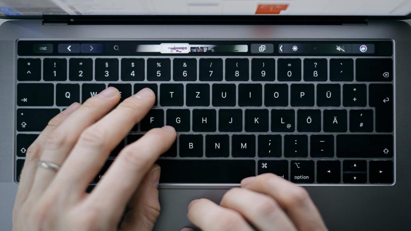 BERLIN, GERMANY - FEBRUARY 04: Symbol photo. A man is typing with his hands on a keyboard of a MacBook Pro on February 04, 2020 in Berlin, Germany. (Photo by Felix Zahn/Photothek via Getty Images)