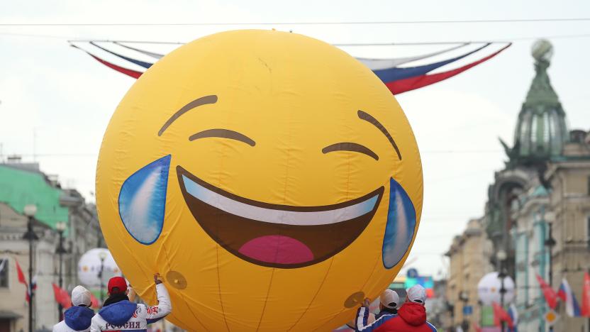 ST PETERSBURG, RUSSIA - MAY 26, 2019: People carry a giant Emoji balloon during a parade in Nevsky Avenue as part of the festivities marking the 316th birthday of the city of St Petersburg. Peter Kovalev/TASS (Photo by Peter Kovalev\TASS via Getty Images)