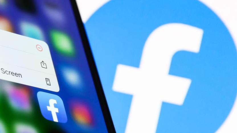 Facebook icon displayed on a phone screen and Facebook logo displayed on a screen in the background are seen in this illustration photo taken in Krakow, Poland on April 6, 2022. (Photo by Jakub Porzycki/NurPhoto via Getty Images)