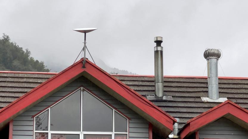 View of an antenna of the Starlink satellite internet at the Jhon F. Kennedy school in Sotomo, Los Lagos Region in southern Chile, on August 8, 2021. - South African billionaire Elon Mask's SpaceX company's Starlink started to deliver internet access Friday in Chile, making it the first country in Latin America and the southern hemisphere to have access to this experimental service. (Photo by Pablo COZZAGLIO / AFP) (Photo by PABLO COZZAGLIO/AFP via Getty Images)