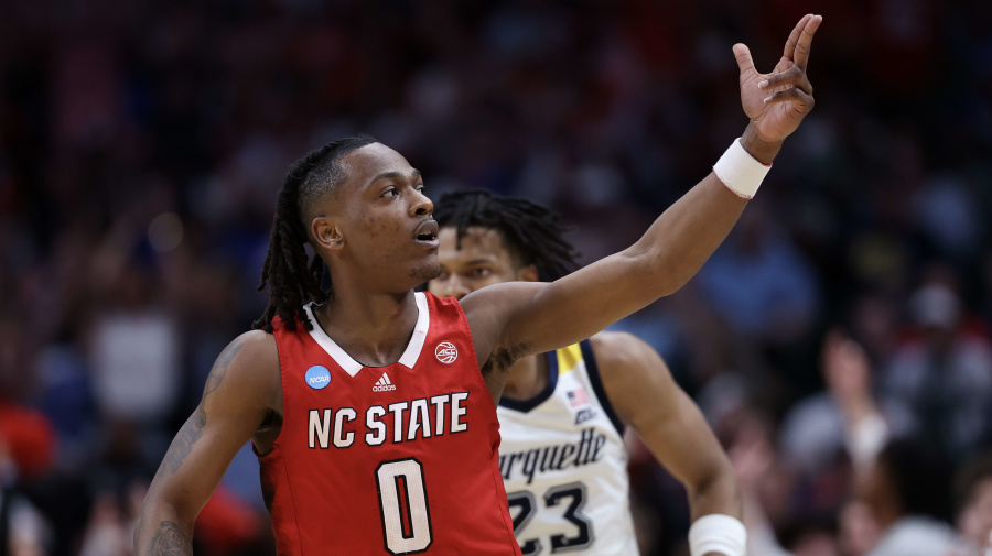 Getty Images - DALLAS, TEXAS - MARCH 29: DJ Horne #0 of the North Carolina State Wolfpack reacts against the Marquette Golden Eagles during the second half in the Sweet 16 round of the NCAA Men's Basketball Tournament at American Airlines Center on March 29, 2024 in Dallas, Texas. (Photo by Patrick Smith/Getty Images)